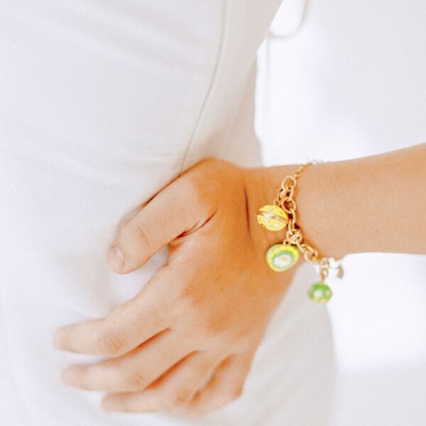 Gold-tone green bead charm bracelet