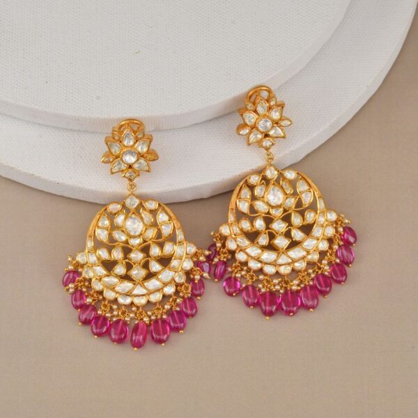 Gold-tone kundan-style chandbali earrings with pink beads