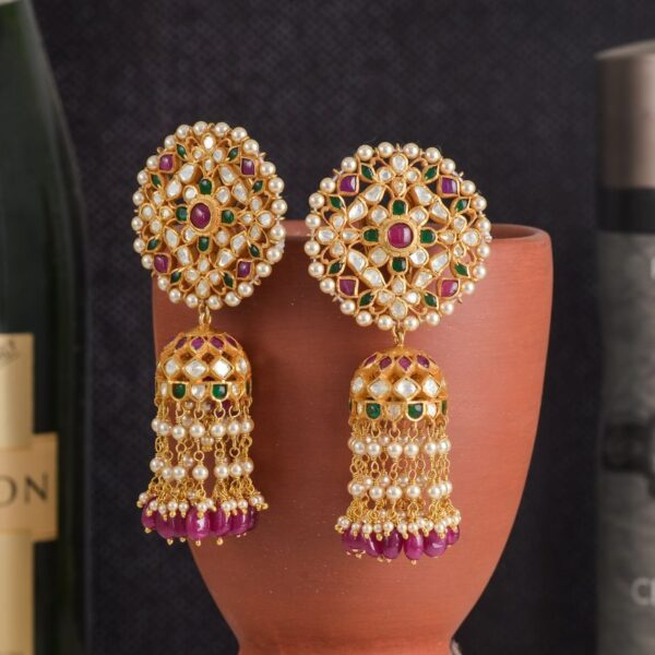 Gold-tone kundan-style jhumka earrings with pink beads