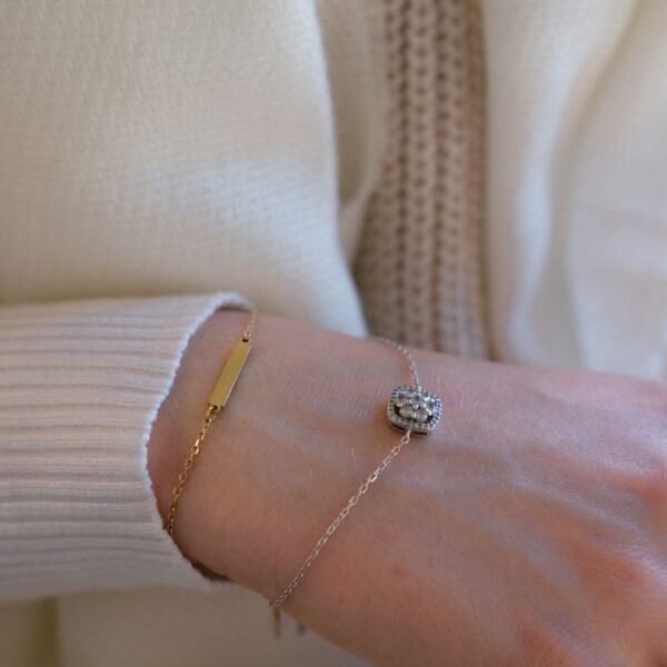 Gold-tone bar bracelet with crystal charm