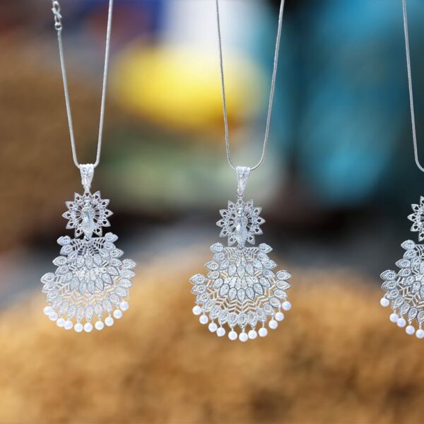 Silver-tone chandelier earrings with pearl drops