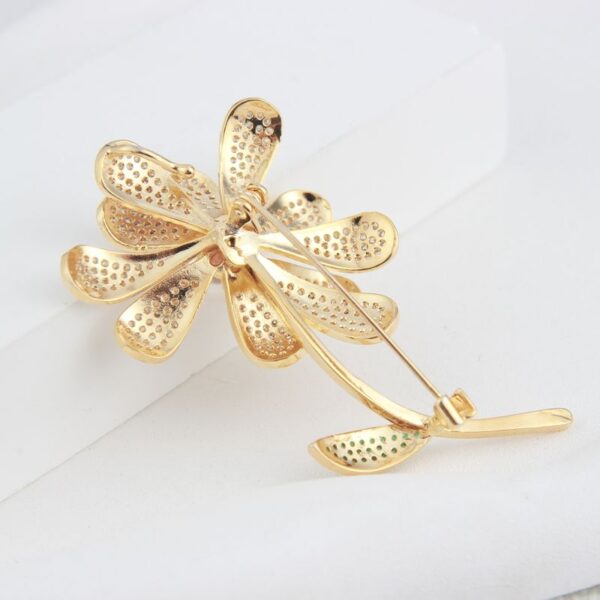 Gold-tone filigree flower brooch
