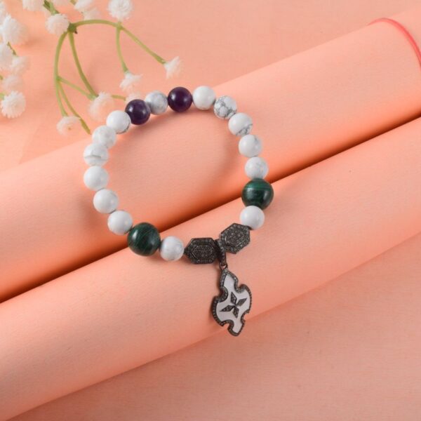 White bead stretch bracelet with charm