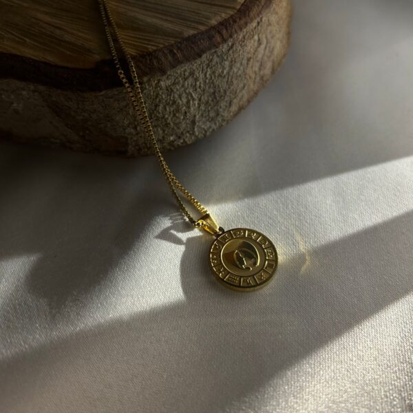 Gold-tone coin pendant necklace