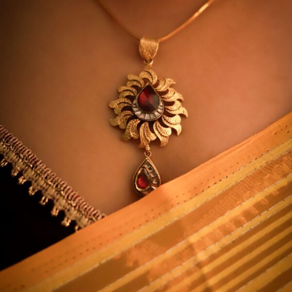 Gold-tone ruby-red flower pendant necklace