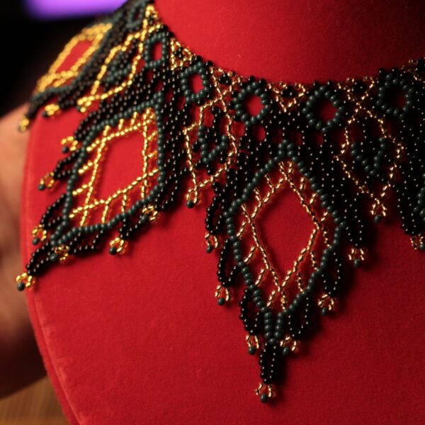 Black and gold-tone beaded collar necklace