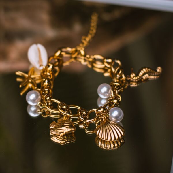 Gold-tone pearl and seashell chain bracelet