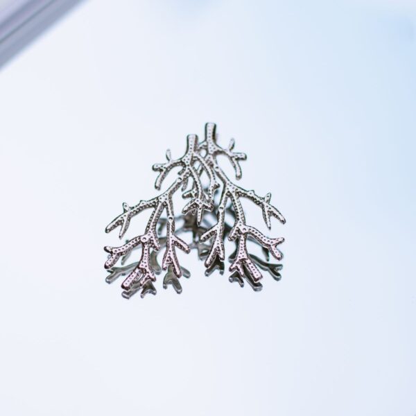 Silver-tone coral brooch