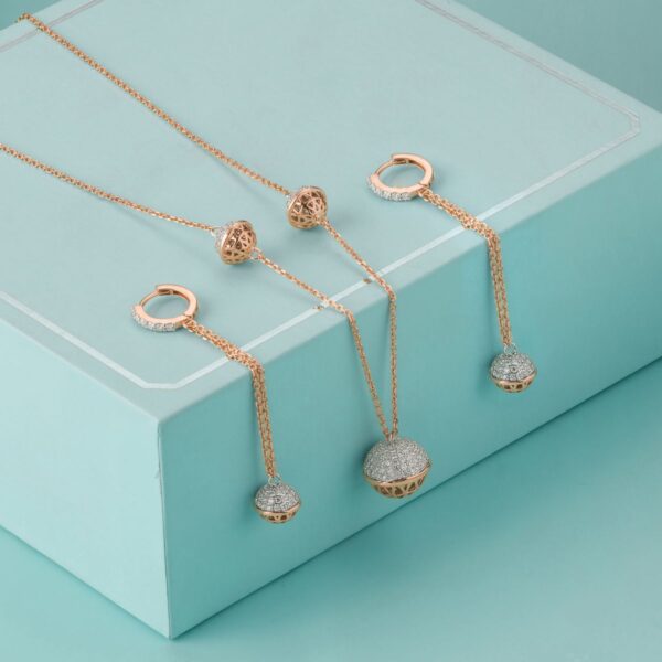 Rose gold-tone pendant necklace and earring set