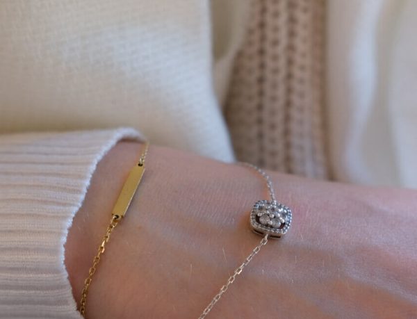 Layered gold-tone necklaces styled together